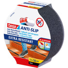 Tesa skrid tape i sort, rullet op, klar til brug
